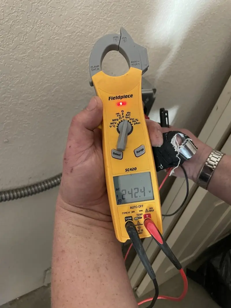 Voltage testing with clamp meter during Ceiling Fan Installation in Dundee